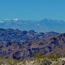 Snowy Spring Mountains seen from the way to the Lookout Kingman Wash